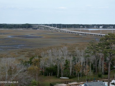 Build your beach house on this lovely lot with marsh views and on Oak Island Golf Club in North Carolina - for sale on GolfHomes.com, golf home, golf lot