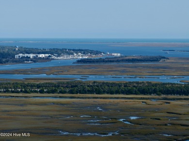 Build your beach house on this lovely lot with marsh views and on Oak Island Golf Club in North Carolina - for sale on GolfHomes.com, golf home, golf lot