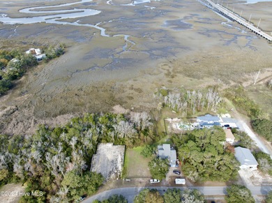 Build your beach house on this lovely lot with marsh views and on Oak Island Golf Club in North Carolina - for sale on GolfHomes.com, golf home, golf lot