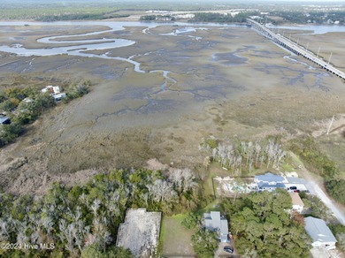 Build your beach house on this lovely lot with marsh views and on Oak Island Golf Club in North Carolina - for sale on GolfHomes.com, golf home, golf lot