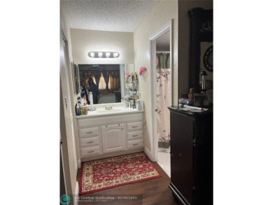 LOVELY CONDO IN QUIET ALL AGES GATED COMMUNITY! INVESTOR on Inverrary Country Club in Florida - for sale on GolfHomes.com, golf home, golf lot