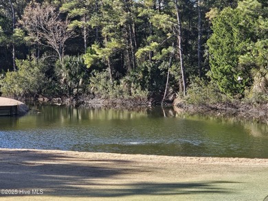 Beautiful golf course homesite with views of the lagoon and on Bald Head Island Golf Club in North Carolina - for sale on GolfHomes.com, golf home, golf lot