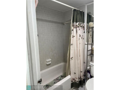 LOVELY CONDO IN QUIET ALL AGES GATED COMMUNITY! INVESTOR on Inverrary Country Club in Florida - for sale on GolfHomes.com, golf home, golf lot