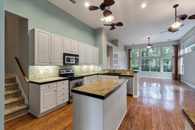 THIS PERFECT GOLF COURSE HOME is framed by majestic trees that on Legend Oaks Plantation Golf Club in South Carolina - for sale on GolfHomes.com, golf home, golf lot