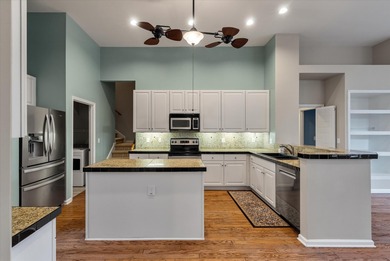 THIS PERFECT GOLF COURSE HOME is framed by majestic trees that on Legend Oaks Plantation Golf Club in South Carolina - for sale on GolfHomes.com, golf home, golf lot