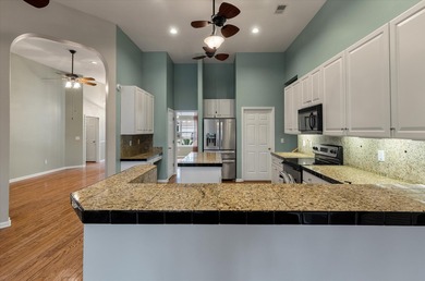 THIS PERFECT GOLF COURSE HOME is framed by majestic trees that on Legend Oaks Plantation Golf Club in South Carolina - for sale on GolfHomes.com, golf home, golf lot