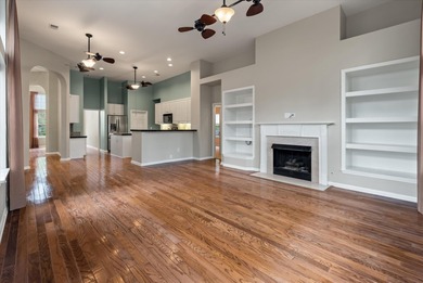 THIS PERFECT GOLF COURSE HOME is framed by majestic trees that on Legend Oaks Plantation Golf Club in South Carolina - for sale on GolfHomes.com, golf home, golf lot