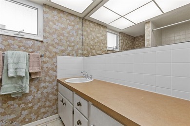 Discover this inviting 3 bedroom, 2 bathroom canalfront home in on Saint Andrews South Golf Club in Florida - for sale on GolfHomes.com, golf home, golf lot