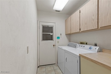 Discover this inviting 3 bedroom, 2 bathroom canalfront home in on Saint Andrews South Golf Club in Florida - for sale on GolfHomes.com, golf home, golf lot