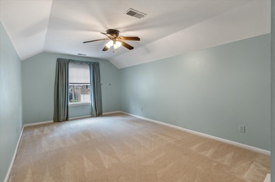 THIS PERFECT GOLF COURSE HOME is framed by majestic trees that on Legend Oaks Plantation Golf Club in South Carolina - for sale on GolfHomes.com, golf home, golf lot