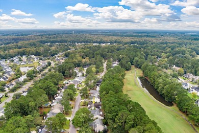 THIS PERFECT GOLF COURSE HOME is framed by majestic trees that on Legend Oaks Plantation Golf Club in South Carolina - for sale on GolfHomes.com, golf home, golf lot