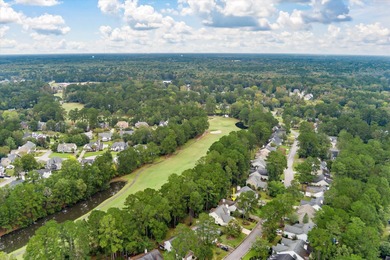 THIS PERFECT GOLF COURSE HOME is framed by majestic trees that on Legend Oaks Plantation Golf Club in South Carolina - for sale on GolfHomes.com, golf home, golf lot