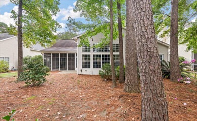 THIS PERFECT GOLF COURSE HOME is framed by majestic trees that on Legend Oaks Plantation Golf Club in South Carolina - for sale on GolfHomes.com, golf home, golf lot
