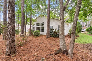 THIS PERFECT GOLF COURSE HOME is framed by majestic trees that on Legend Oaks Plantation Golf Club in South Carolina - for sale on GolfHomes.com, golf home, golf lot