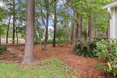 THIS PERFECT GOLF COURSE HOME is framed by majestic trees that on Legend Oaks Plantation Golf Club in South Carolina - for sale on GolfHomes.com, golf home, golf lot
