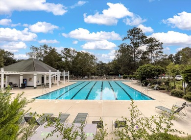THIS PERFECT GOLF COURSE HOME is framed by majestic trees that on Legend Oaks Plantation Golf Club in South Carolina - for sale on GolfHomes.com, golf home, golf lot