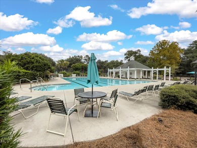 THIS PERFECT GOLF COURSE HOME is framed by majestic trees that on Legend Oaks Plantation Golf Club in South Carolina - for sale on GolfHomes.com, golf home, golf lot