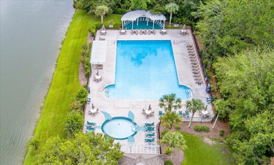 THIS PERFECT GOLF COURSE HOME is framed by majestic trees that on Legend Oaks Plantation Golf Club in South Carolina - for sale on GolfHomes.com, golf home, golf lot