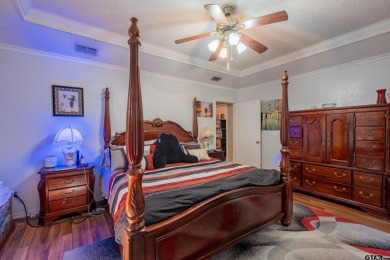 Located in the gated community of Hideaway Lake, this inviting on Hide-A-Way Lake Golf Course in Texas - for sale on GolfHomes.com, golf home, golf lot