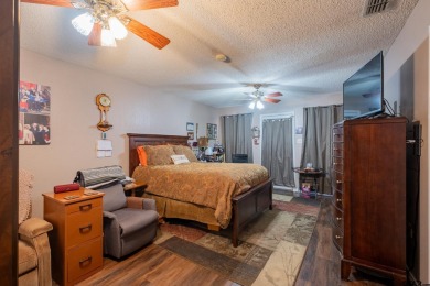 Located in the gated community of Hideaway Lake, this inviting on Hide-A-Way Lake Golf Course in Texas - for sale on GolfHomes.com, golf home, golf lot