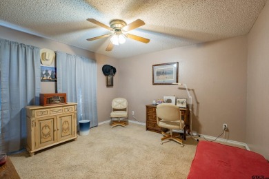 Located in the gated community of Hideaway Lake, this inviting on Hide-A-Way Lake Golf Course in Texas - for sale on GolfHomes.com, golf home, golf lot
