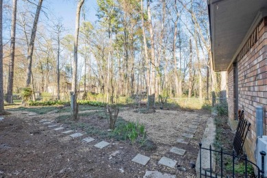 Located in the gated community of Hideaway Lake, this inviting on Hide-A-Way Lake Golf Course in Texas - for sale on GolfHomes.com, golf home, golf lot