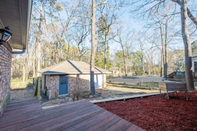 Located in the gated community of Hideaway Lake, this inviting on Hide-A-Way Lake Golf Course in Texas - for sale on GolfHomes.com, golf home, golf lot