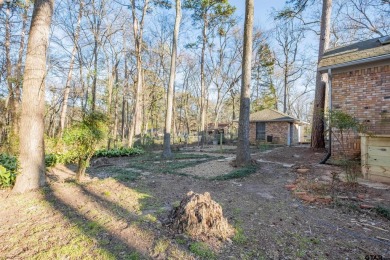 Located in the gated community of Hideaway Lake, this inviting on Hide-A-Way Lake Golf Course in Texas - for sale on GolfHomes.com, golf home, golf lot
