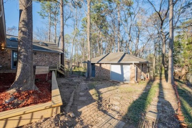 Located in the gated community of Hideaway Lake, this inviting on Hide-A-Way Lake Golf Course in Texas - for sale on GolfHomes.com, golf home, golf lot