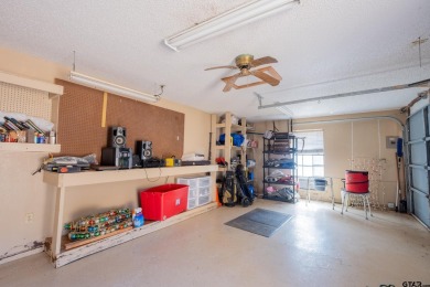 Located in the gated community of Hideaway Lake, this inviting on Hide-A-Way Lake Golf Course in Texas - for sale on GolfHomes.com, golf home, golf lot