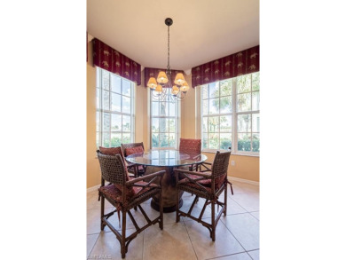 This TURNKEY FURNISHED 2 bedroom plus den first floor end unit on Naples Lakes Country Club in Florida - for sale on GolfHomes.com, golf home, golf lot