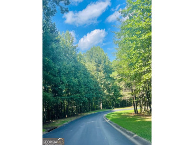 BEAUTIFUL LAKE AND GOLF COURSE HOMESITE WITH VIEW OF THE on Hawks Ridge Golf Club in Georgia - for sale on GolfHomes.com, golf home, golf lot
