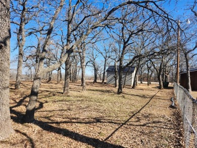 Beautiful corner lot build site with lake views and mature oak on Nocona Hills Golf Course in Texas - for sale on GolfHomes.com, golf home, golf lot