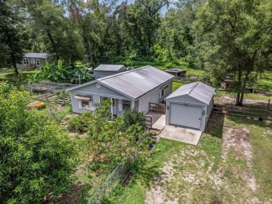 Built in 2014, this move-in ready, well-maintained home features on Wildwood Country Club in Florida - for sale on GolfHomes.com, golf home, golf lot