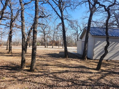 Beautiful corner lot build site with lake views and mature oak on Nocona Hills Golf Course in Texas - for sale on GolfHomes.com, golf home, golf lot