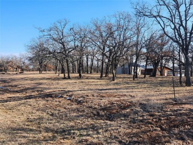 Beautiful corner lot build site with lake views and mature oak on Nocona Hills Golf Course in Texas - for sale on GolfHomes.com, golf home, golf lot