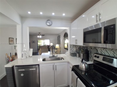 MUST SEE! Beautiful completely remodeled penthouse 2/2 condo in on Sunrise Lakes Phase IV Golf Course in Florida - for sale on GolfHomes.com, golf home, golf lot