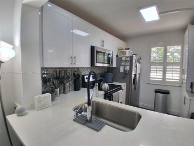 MUST SEE! Beautiful completely remodeled penthouse 2/2 condo in on Sunrise Lakes Phase IV Golf Course in Florida - for sale on GolfHomes.com, golf home, golf lot
