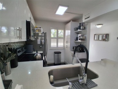 MUST SEE! Beautiful completely remodeled penthouse 2/2 condo in on Sunrise Lakes Phase IV Golf Course in Florida - for sale on GolfHomes.com, golf home, golf lot