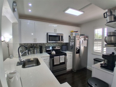 MUST SEE! Beautiful completely remodeled penthouse 2/2 condo in on Sunrise Lakes Phase IV Golf Course in Florida - for sale on GolfHomes.com, golf home, golf lot