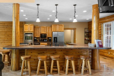 Stunning, custom-built log home overlooking the 16th tee & on Cedar River Golf Course in Michigan - for sale on GolfHomes.com, golf home, golf lot