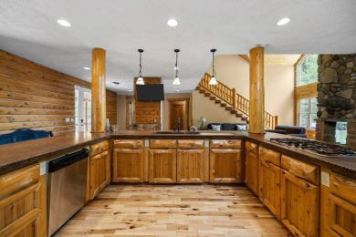 Stunning, custom-built log home overlooking the 16th tee & on Cedar River Golf Course in Michigan - for sale on GolfHomes.com, golf home, golf lot