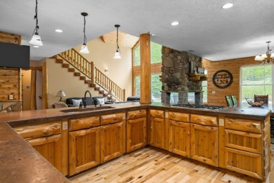 Stunning, custom-built log home overlooking the 16th tee & on Cedar River Golf Course in Michigan - for sale on GolfHomes.com, golf home, golf lot