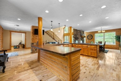 Stunning, custom-built log home overlooking the 16th tee & on Cedar River Golf Course in Michigan - for sale on GolfHomes.com, golf home, golf lot