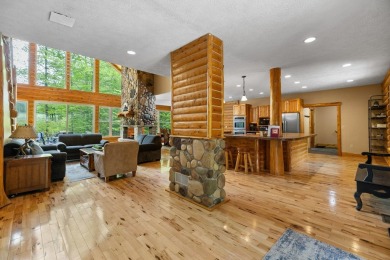 Stunning, custom-built log home overlooking the 16th tee & on Cedar River Golf Course in Michigan - for sale on GolfHomes.com, golf home, golf lot