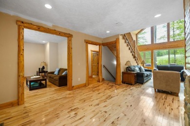 Stunning, custom-built log home overlooking the 16th tee & on Cedar River Golf Course in Michigan - for sale on GolfHomes.com, golf home, golf lot