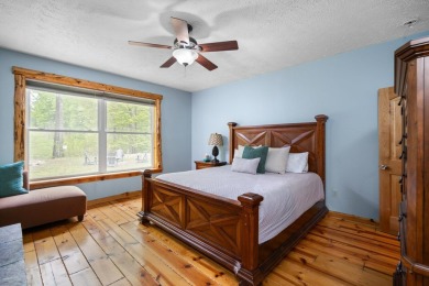 Stunning, custom-built log home overlooking the 16th tee & on Cedar River Golf Course in Michigan - for sale on GolfHomes.com, golf home, golf lot