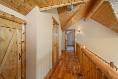 Stunning, custom-built log home overlooking the 16th tee & on Cedar River Golf Course in Michigan - for sale on GolfHomes.com, golf home, golf lot