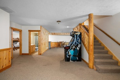 Stunning, custom-built log home overlooking the 16th tee & on Cedar River Golf Course in Michigan - for sale on GolfHomes.com, golf home, golf lot