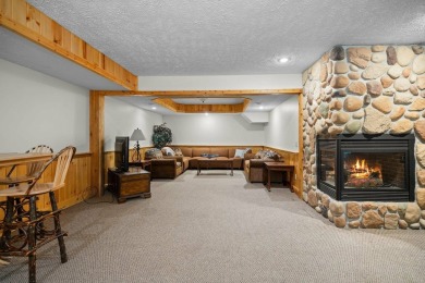 Stunning, custom-built log home overlooking the 16th tee & on Cedar River Golf Course in Michigan - for sale on GolfHomes.com, golf home, golf lot